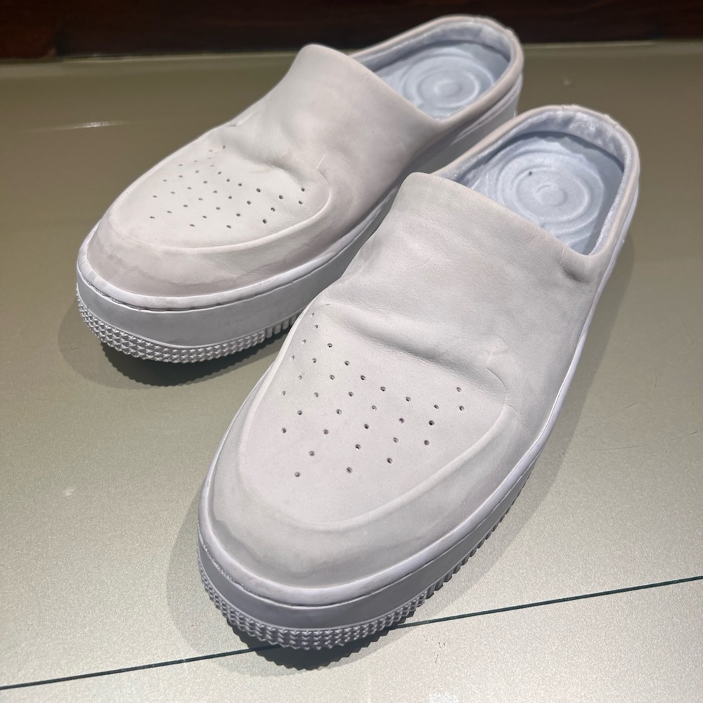 Adorable white suede like Nike slip on clogs with pink accent on toe.